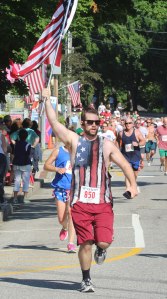Evan Turner (850) carries the colors down Main Street