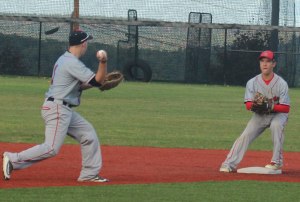 Central Maine shortstop Kyle Moore tosses to 2B Trent Spaulding