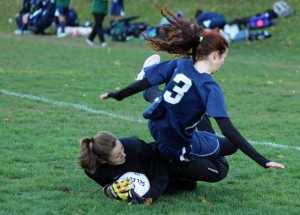 Ella Spiess flies over Amesbury goalie Alli Napoli