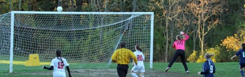 Amesbury shot grazes the crossbar in the first half