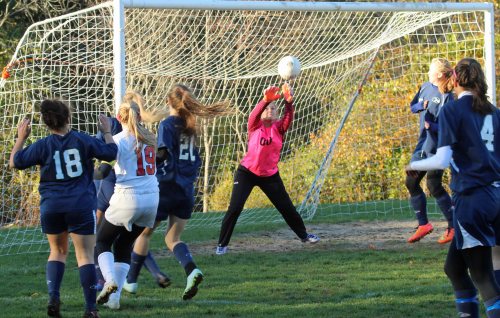 The shot of Mollie Lynch (19) goes over ET goalie Olivia Cassidy