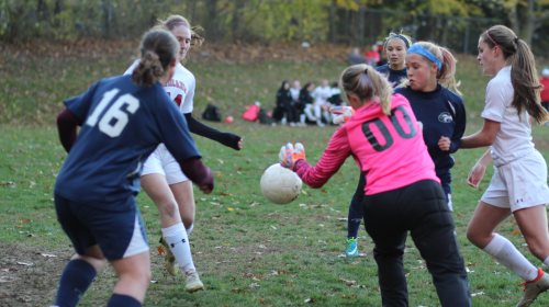 Ashlee Porcaro (left 14) set to cash in a loose ball