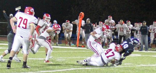 Josh Anderson (47) brings down Lewi L'Heureux to finish the game