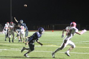 Ball on the way to Danny Monagle (10) with Lewi L'Heureux defending