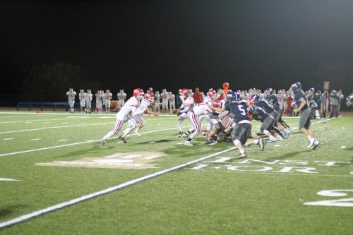 Tim Beliveau (23) heads up the middle