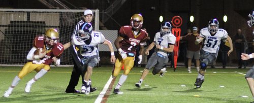 Bryan Hughes (21) tries to trap Clipper QB Rob Shay in the end zone