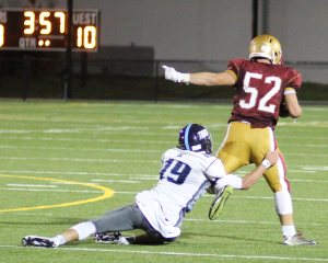 Triton QB Lewi L'Heureux turns defender after giving up an interception to Brian Toolan.