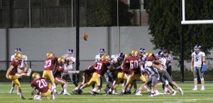 Joel Skaff kicks an extra point after Newburyport's first touchdown