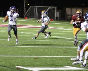 Tom Lapham (2) loose around the right end.