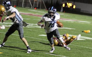 Penalty flag (holding) flies during Lewi L'Heureux run
