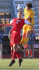 Matthew Dzwil (8) battles in the air