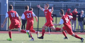 Mike Budrewicz and teammates celebrate goal