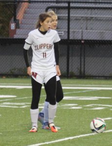 Margaret Cote and Amelia Kroschwitz about to set the goal-scoring direct kick into motion