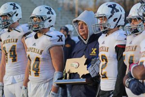 Xaverian coach Charlie Stevenson with the Hawks trophy