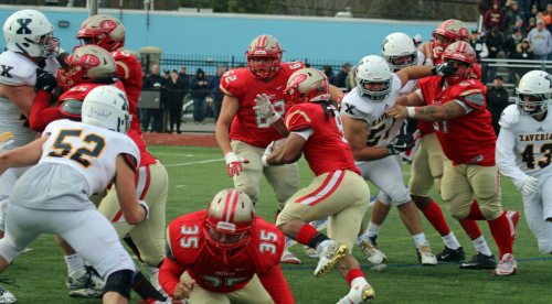 Marvens Fedna (9) goes through a huge hole to score untouched.