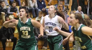 Taylor Moore (33) and Emily Riley (31) eye one of the many rebounds off of free throws.