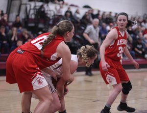 Flannery O'Connor tries to get the ball from Katie Hadden