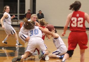 Chelsea Lynch surrounded by a trio of Vikings