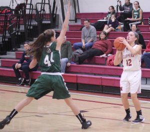 Freshman Maggie Pons defended by freshman Bridget Twombly