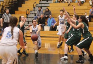 Mel Primpas sets up teammate Bridgett Sheehan for a layup with a nice pass
