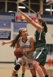 Alex Kennedy tries to find a way to get a shot off against Sarah Robinson.