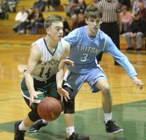 Sophomore Gus Flaherty chased by Cameron Willey