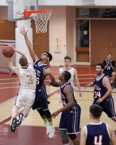 Nick Rogers (14 points) guarded by Dantai Robertson