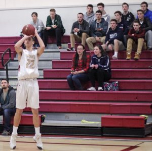 Casey McLaren shoots as Pentucket watches