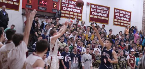 Nick Rogers shoots from in front of the NHS student section