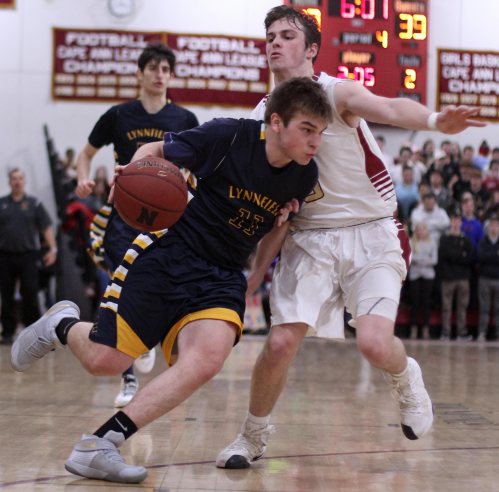 Billy Arseneault (16 points) tries to get past Cam MacRae (14 points)