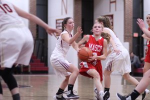 Mak Graves (15 points) finds a way to split two Newburyport defenders
