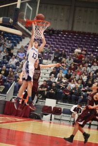 Junior Mike Norton above the rim after a steal