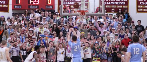 Triton's Jack McCarthy shoots a free throw facing the active Newburyport student section