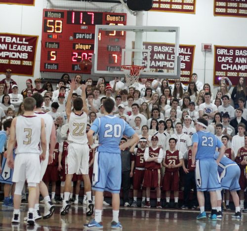 Casey McLaren at the line, in front of the Newburyport student section, with 11.4 seconds left